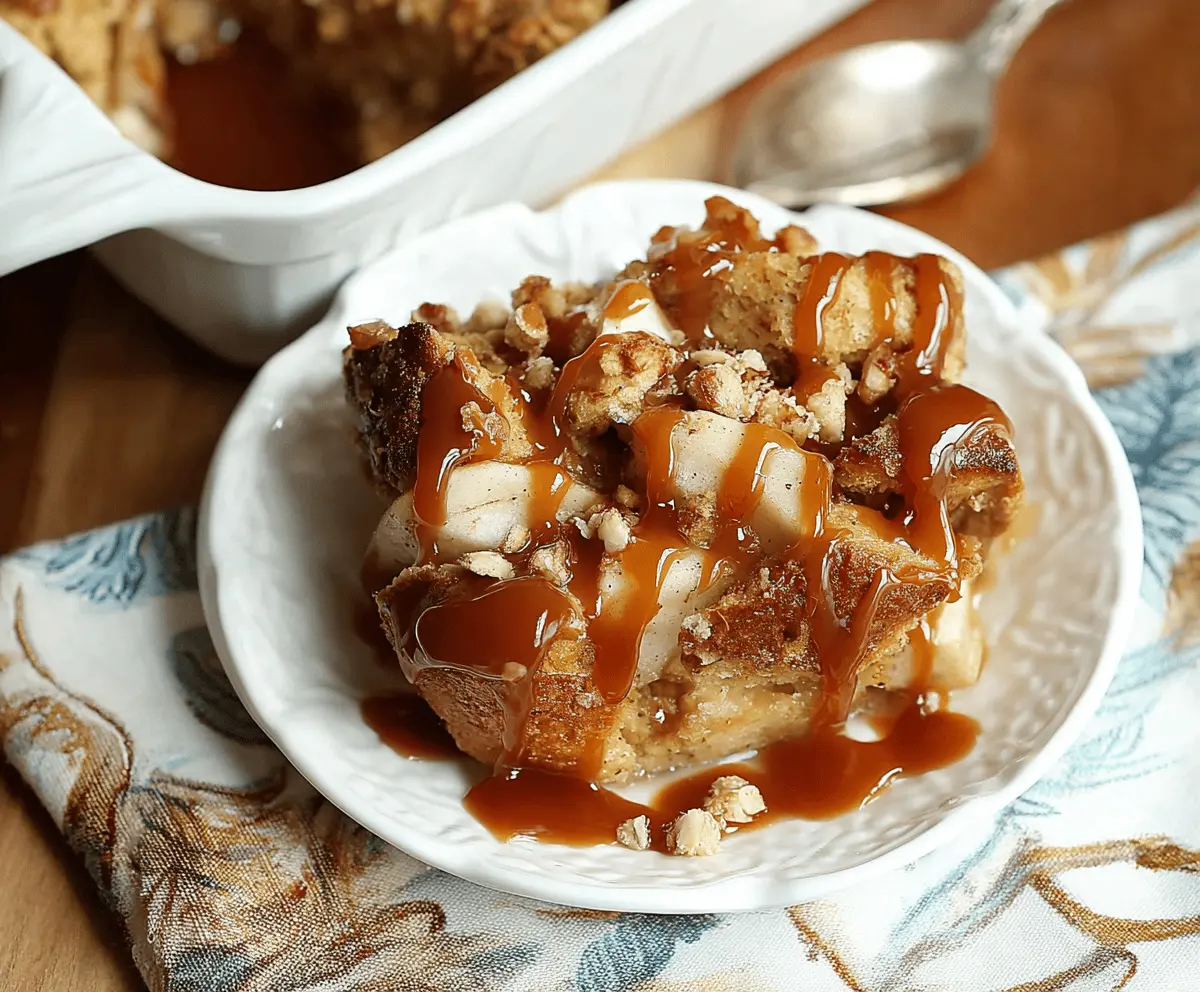 Delicious caramel apple bread pudding topped with caramel sauce and cinnamon, served as a warm dessert