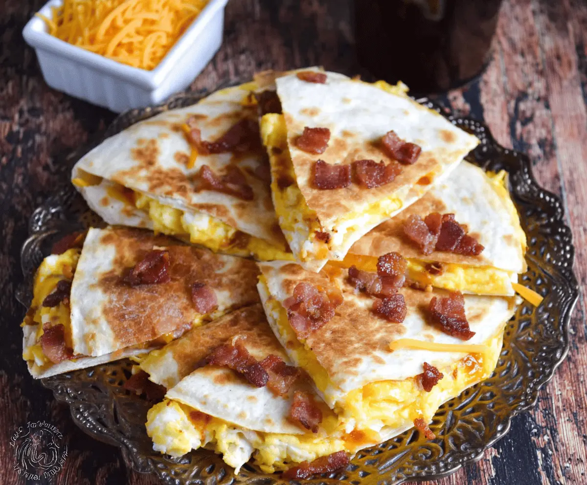 Delicious bacon, egg, and cheese breakfast quesadillas served hot and crispy.