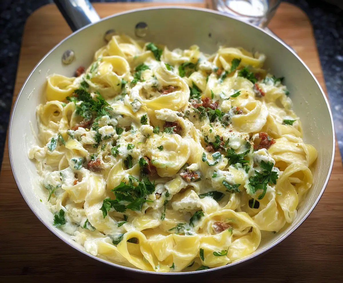Creamy Blue Cheese Pasta dish garnished with fresh herbs on a rustic plate.