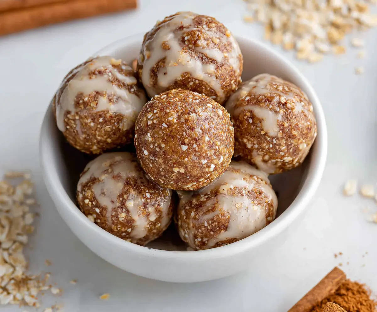Delicious cinnamon roll energy bites with a sweet glaze and cinnamon swirl.