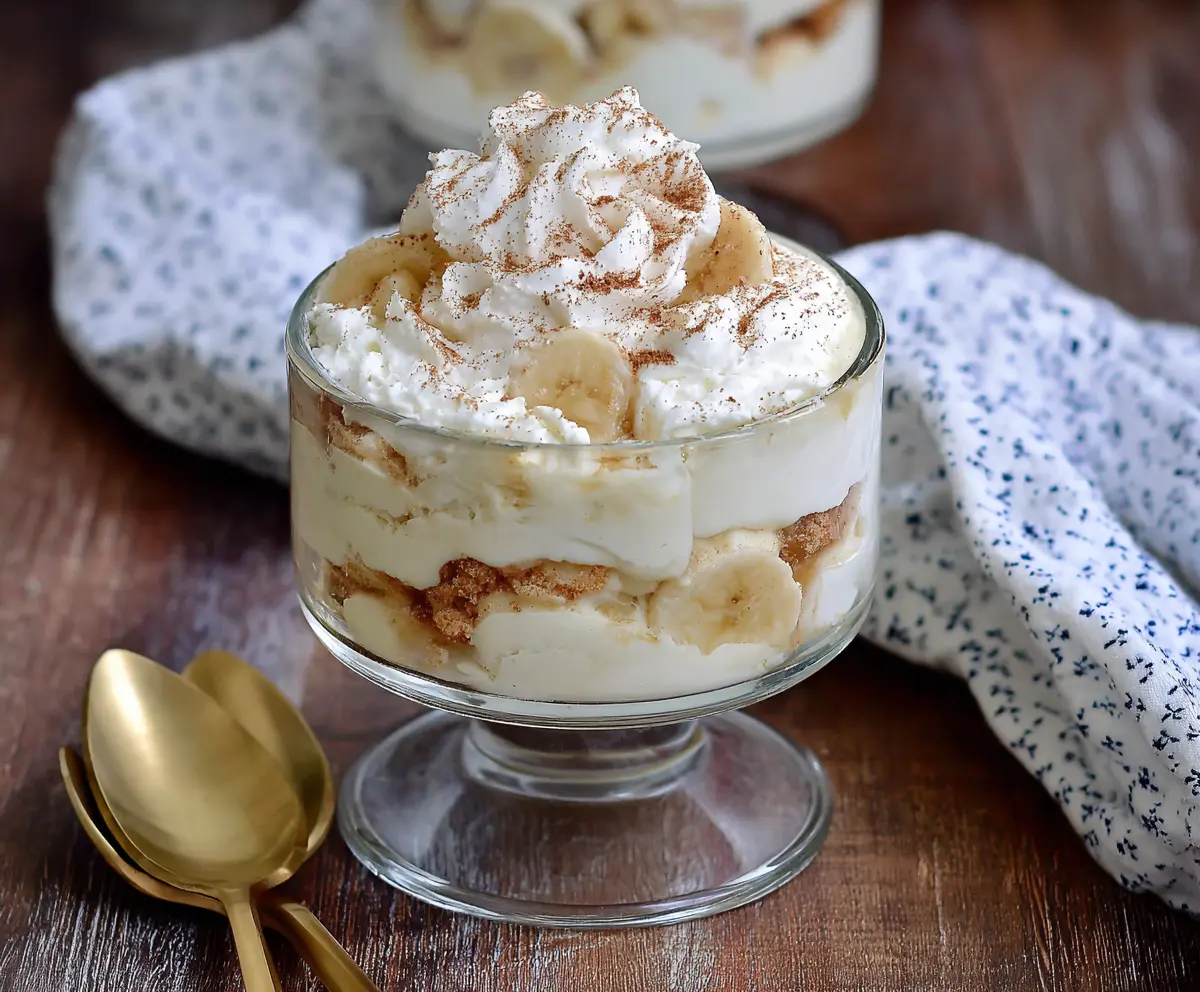 Delicious Cottage Cheese Banana Pudding served in a glass bowl with banana slices and whipped cream topping