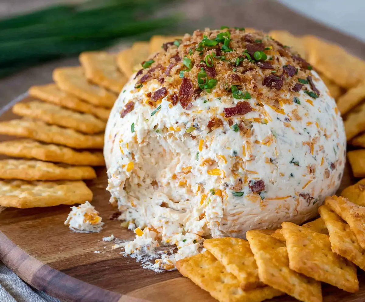 Delicious Cheddar Ranch Cheeseball on a plate, perfect for snacking and gatherings.