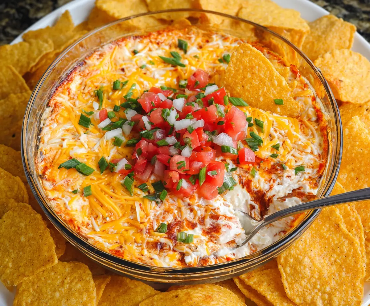Cream Cheese Salsa Dip served in a bowl with fresh vegetables and tortilla chips for a delicious snack.