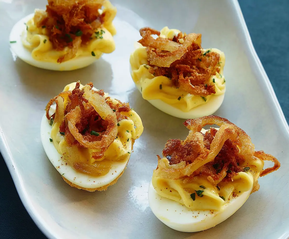 Delicious French Onion Deviled Eggs with caramelized onion topping and creamy filling.