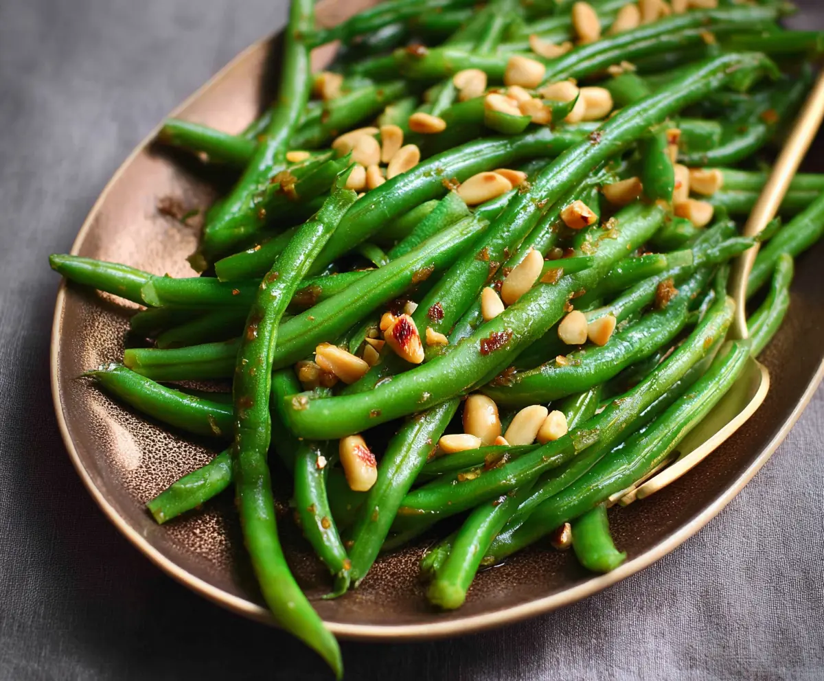 Fresh green beans cooked with toasted pine nuts for a healthy side dish